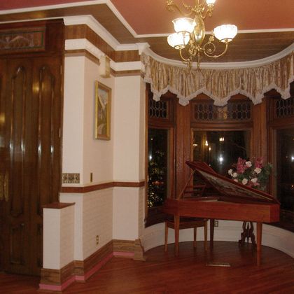 Tall entrance doors with Victorian Wallpaper